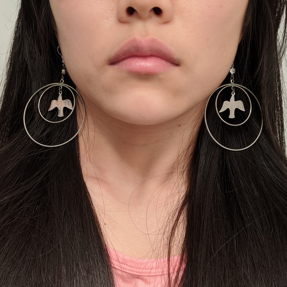 Silver tone bird drop hoop earrings